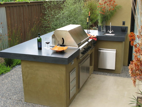 Honed Absolute Black Granite Countertop with L Shaped Stucco Counter Base and Stainless Steel Cabinets and Appliance